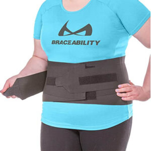 woman wearing a plus size back brace while exercising