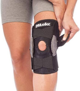 a woman wears knee hyperextension brace to ease her knee pain