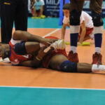 An athlete wearing a ankle brace after injury during a volleyball match