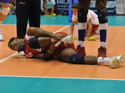 An athlete wearing a ankle brace after injury during a volleyball match