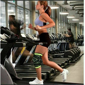 women running in gym with ascender knee brace